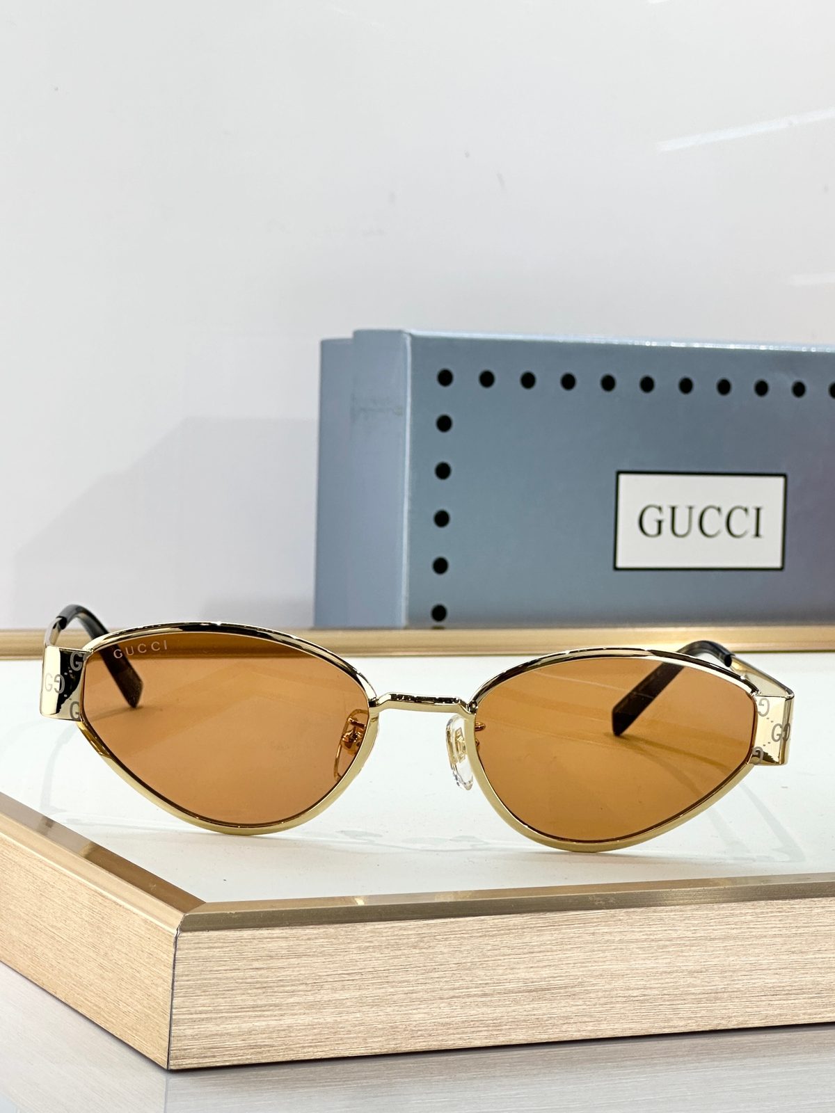 Gucci Gold-Tone Oval Sunglasses with Brown Lenses