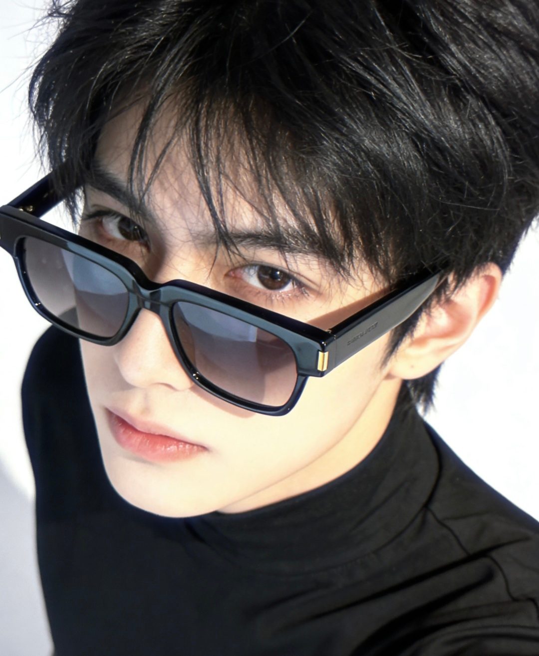 Unable to identify - images show sunglasses worn by a model, not product photography of luxury accessories/bags/wallets/belts