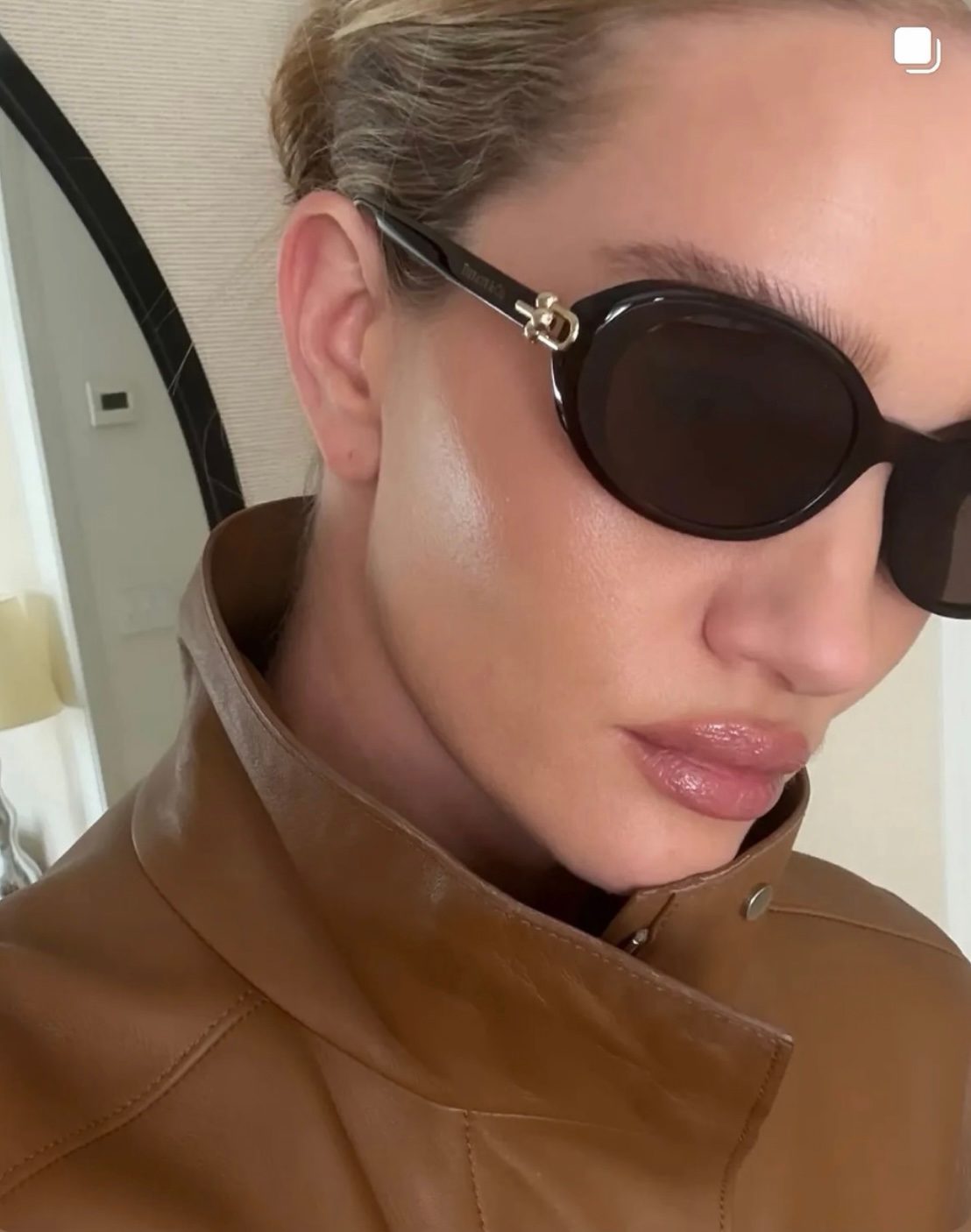 Black Oval Sunglasses with Gold Hardware