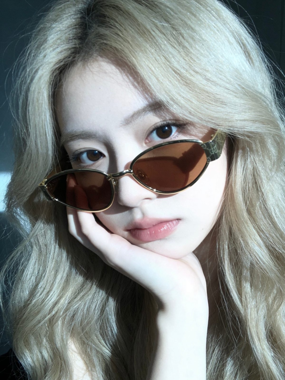 Unable to identify - images show person wearing sunglasses, not product