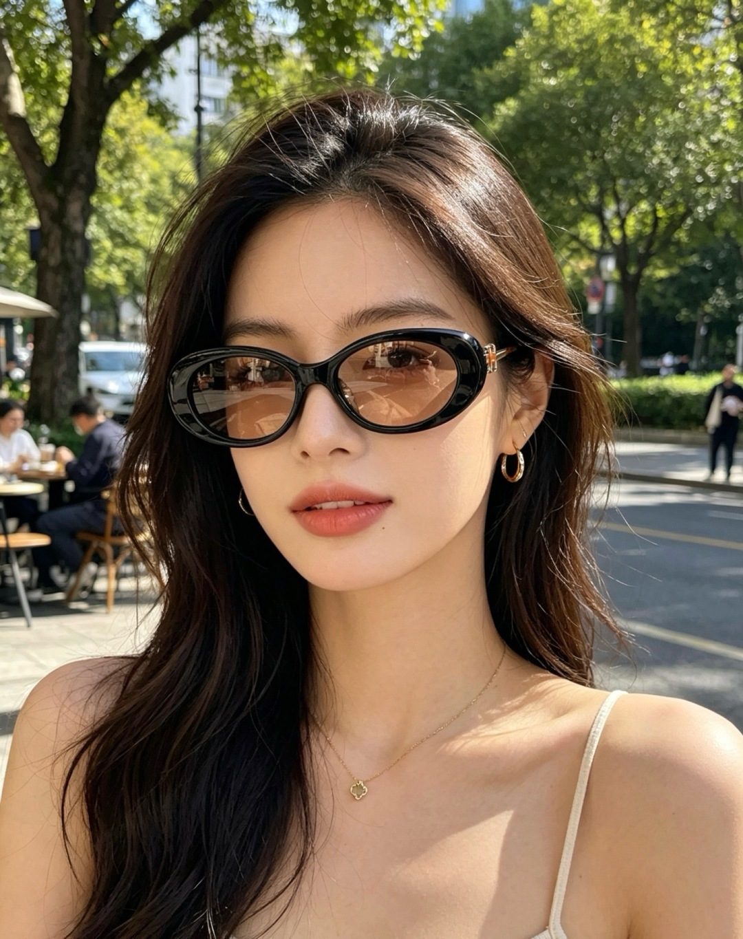 Black Oval Frame Sunglasses with Gold Hardware