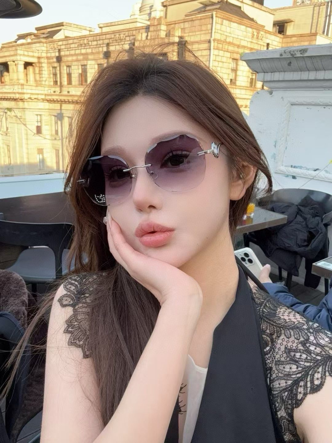 Unable to identify - images show person wearing sunglasses, not product