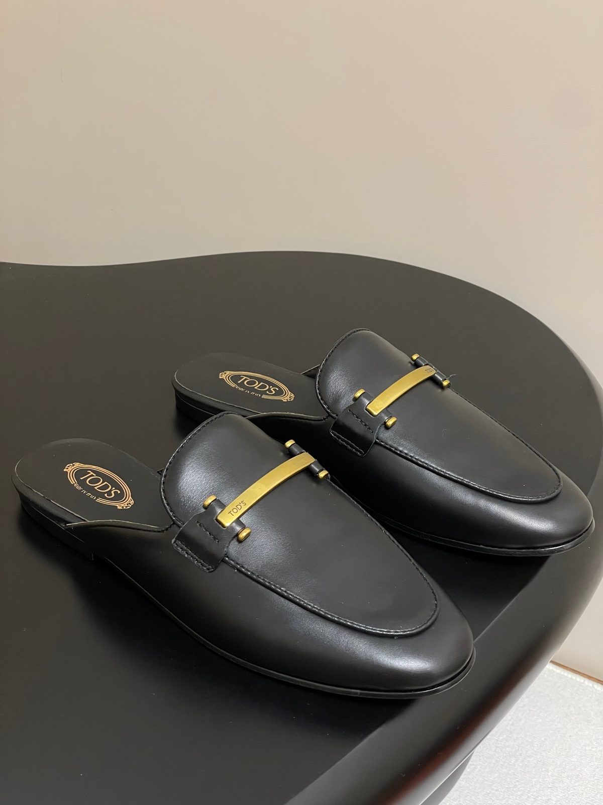 Tod's Black Leather Loafer Mules with Gold Hardware