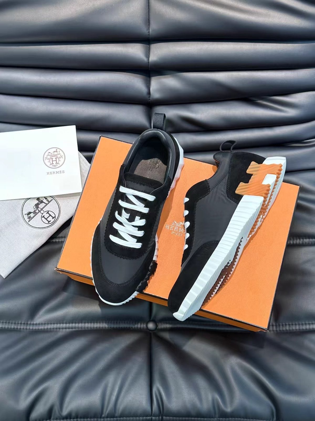Hermès Black Leather Sneaker with Orange Sole