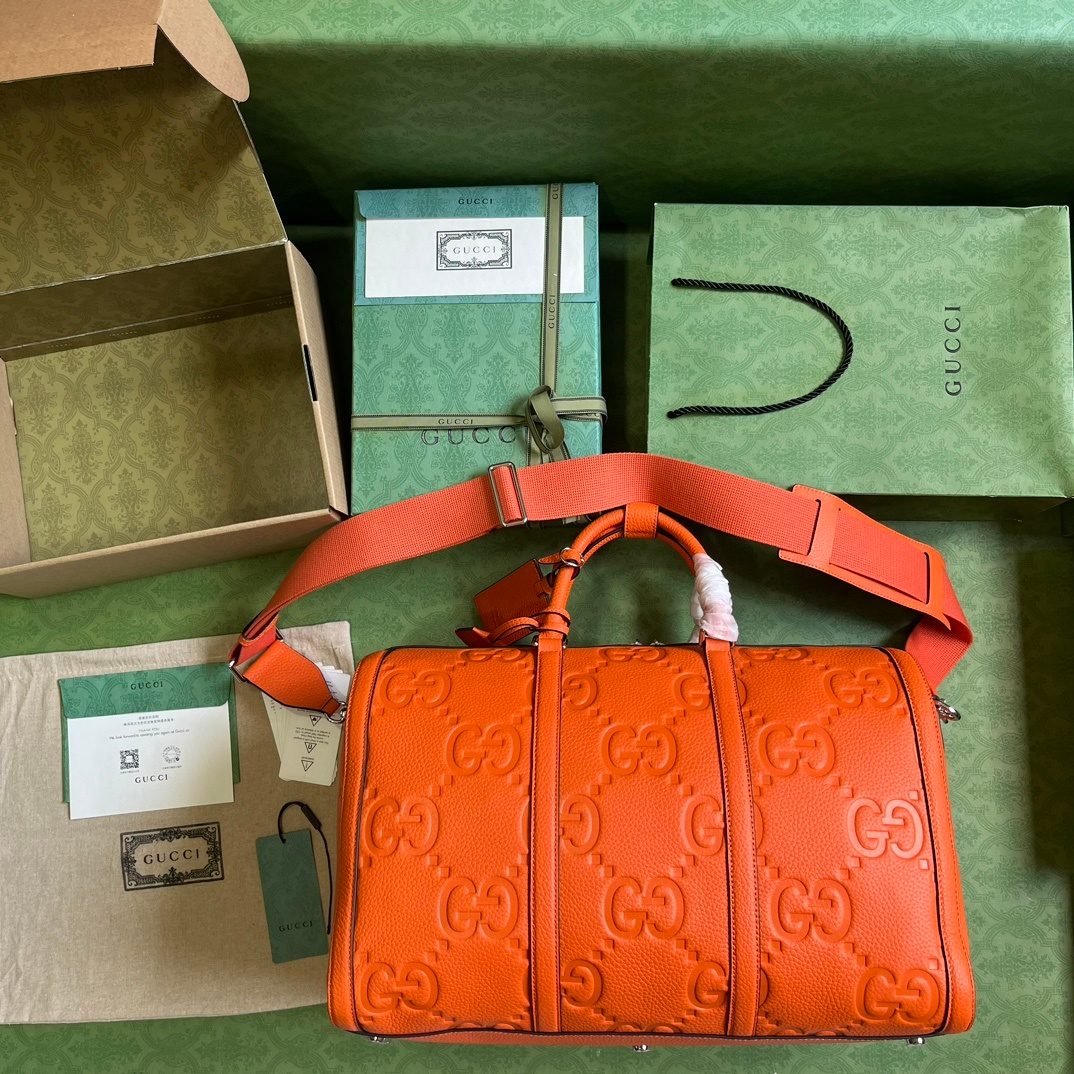 Gucci GG Embossed Orange Leather Duffel Bag