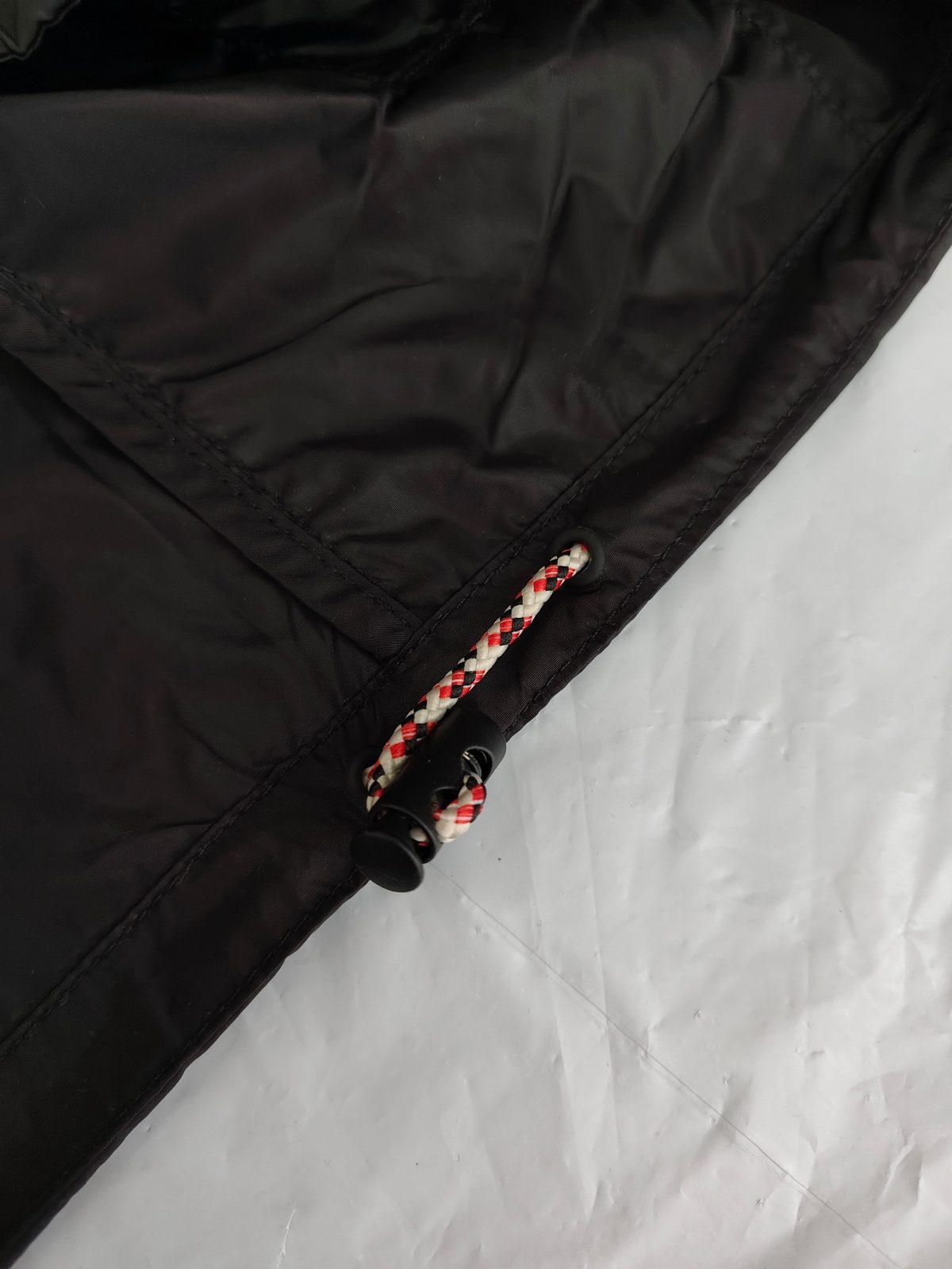Black Nylon Jacket with Red Argyle Drawstring